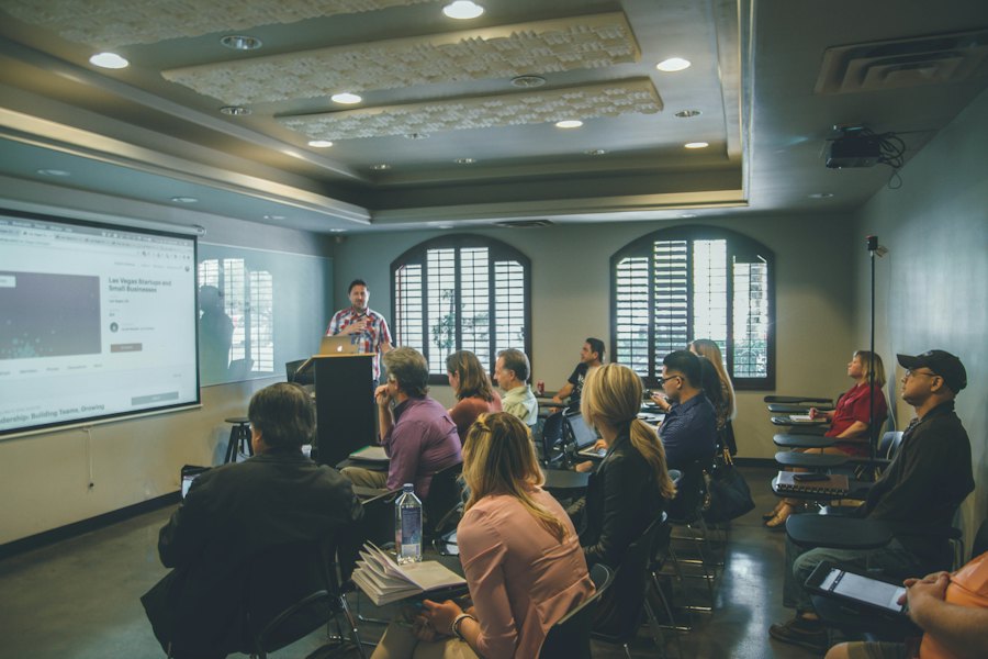 A lecture room with students facing a presenter